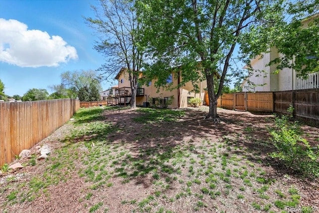 4150 Gleneagle Ct, Colorado Springs, CO 80909 - fenced backyard with a wooden deck and stairs