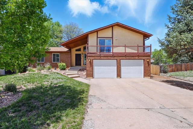 4150 Gleneagle Ct, Colorado Springs, CO 80909 - view of front facade with a garage, driveway, brick siding, and stucco siding