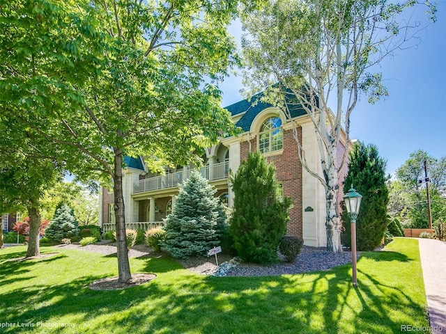 301 Garfield St Unit 1E, Denver, CO 80206 - view of front of house featuring brick siding and a front lawn