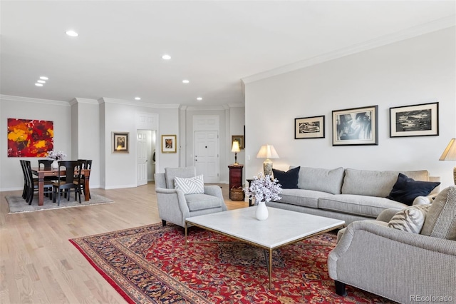 301 Garfield St Unit 1E, Denver, CO 80206 - living room featuring light wood-style flooring, recessed lighting, ornamental molding, and baseboards