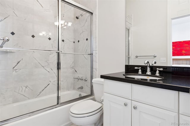 301 Garfield St Unit 1E, Denver, CO 80206 - bathroom with vanity, combined bath / shower with glass door, and toilet