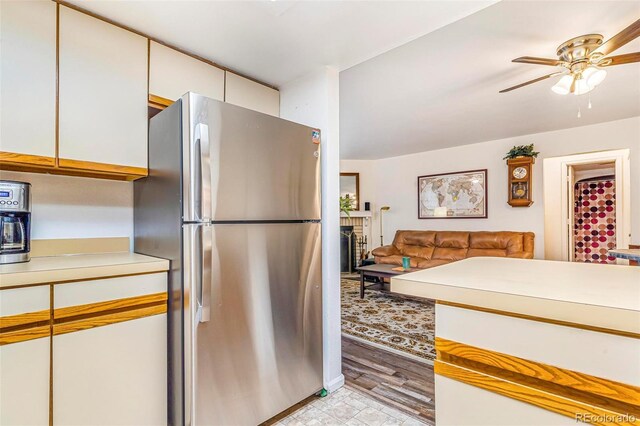 12655 E Pacific Cir Unit E, Aurora, CO 80014 - kitchen featuring freestanding refrigerator, light countertops, a ceiling fan, and light wood-style floors