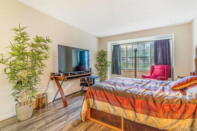 12655 E Pacific Cir Unit E, Aurora, CO 80014 - bedroom featuring wood finished floors and baseboards
