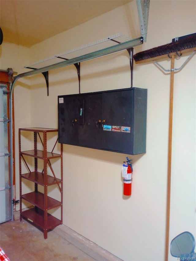 12655 E Pacific Cir Unit E, Aurora, CO 80014 - garage view of a fire extinguisher and concrete floors