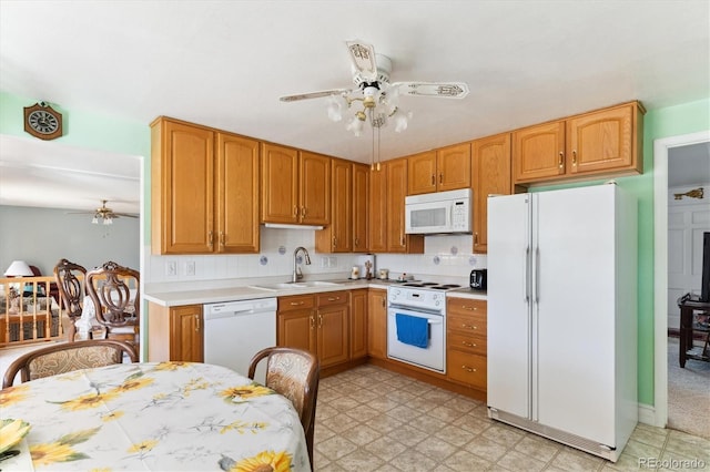 kitchen featuring ceiling fan, sink, white appliances, and decorative backsplash