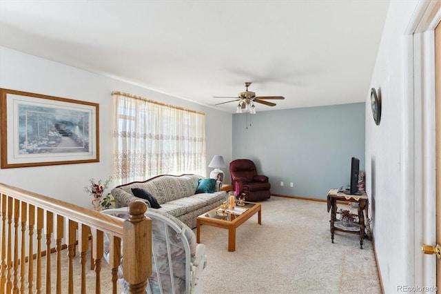 living room featuring ceiling fan and light colored carpet