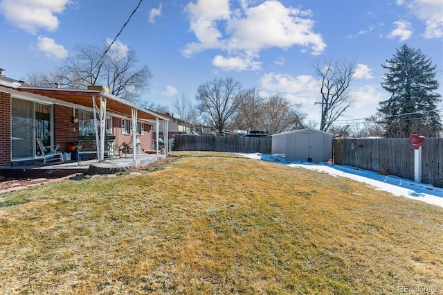 view of yard featuring a patio area and a storage shed