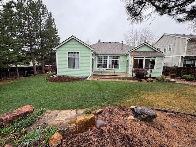 9806 Hooker Ct, Denver, CO 80031 - back of property with a patio area and roof with shingles