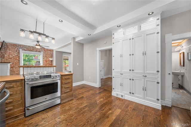 3254 Newton St, Denver, CO 80211 - kitchen featuring stainless steel electric stove, a ceiling fan, dark wood finished floors, white cabinets, and recessed lighting