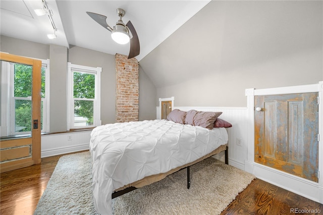 3254 Newton St, Denver, CO 80211 - bedroom featuring wood finished floors, a wainscoted wall, a ceiling fan, track lighting, and attic access