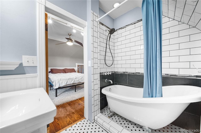 3254 Newton St, Denver, CO 80211 - ensuite bathroom featuring a wainscoted wall and ceiling fan