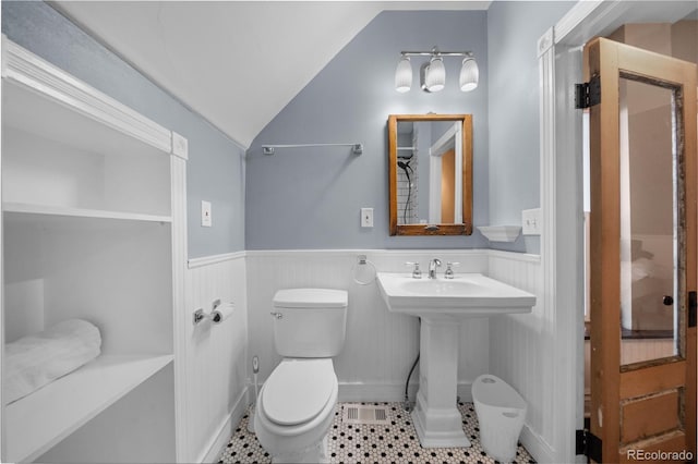 3254 Newton St, Denver, CO 80211 - bathroom with a wainscoted wall, lofted ceiling, and tile patterned flooring