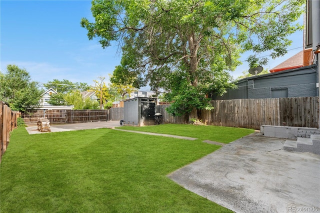 3254 Newton St, Denver, CO 80211 - fenced backyard with a patio area and a storage unit