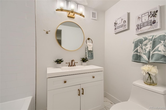 bathroom featuring vanity and toilet