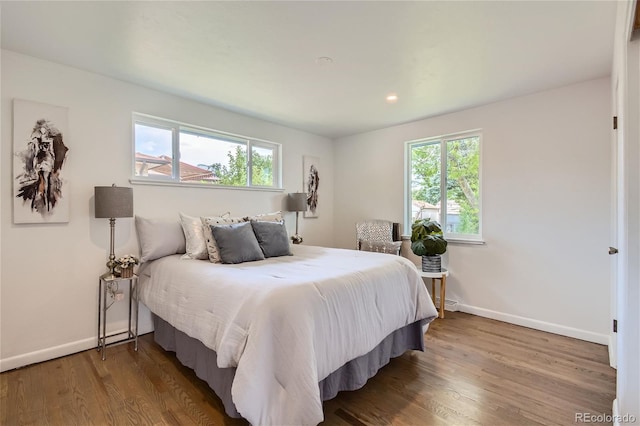 bedroom with wood-type flooring