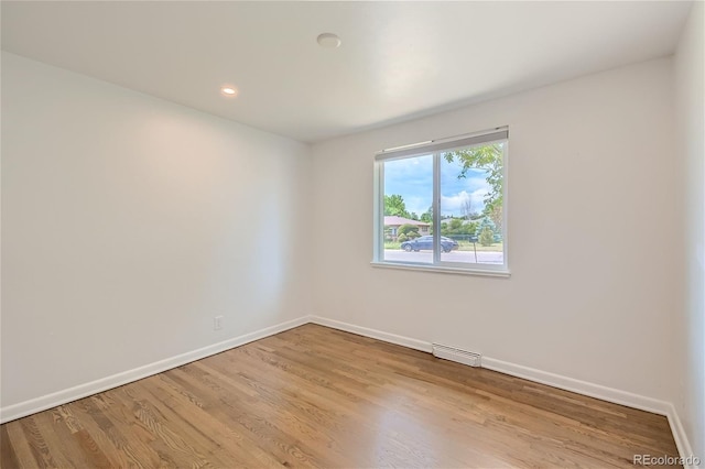 unfurnished room featuring light hardwood / wood-style flooring