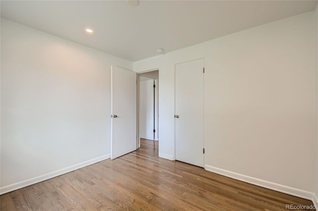 spare room with light hardwood / wood-style floors