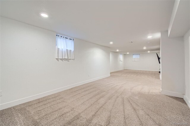 basement with light colored carpet