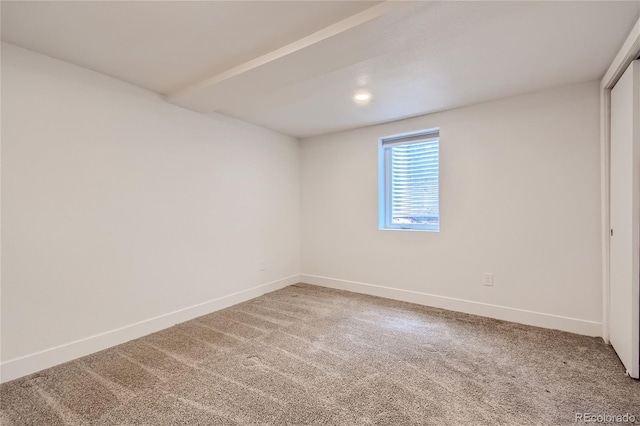 empty room featuring carpet flooring