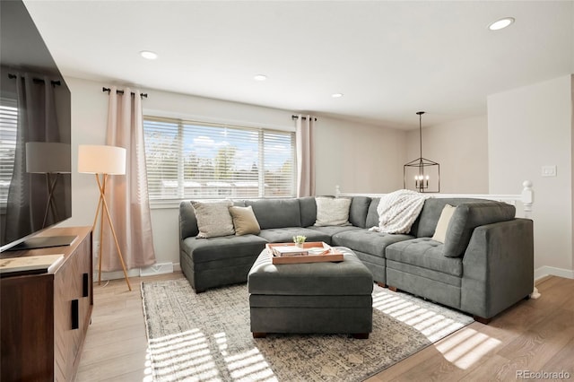 6163 W 76th Ave, Arvada, CO 80003 - living area featuring a chandelier, light wood-type flooring, and recessed lighting