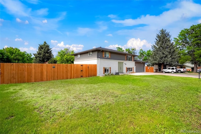 6163 W 76th Ave, Arvada, CO 80003 - view of side of home featuring driveway, a garage, and stucco siding