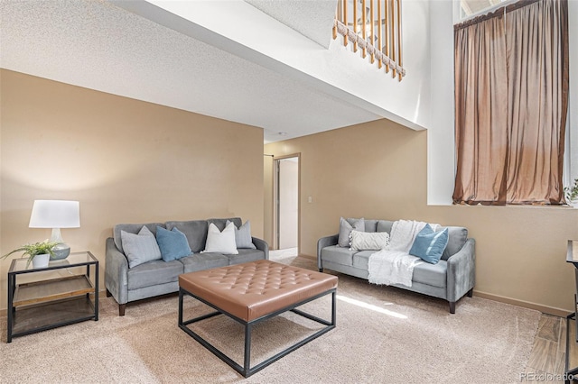 10152 Telluride St, Littleton, CO 80125 - carpeted living area featuring baseboards and a textured ceiling