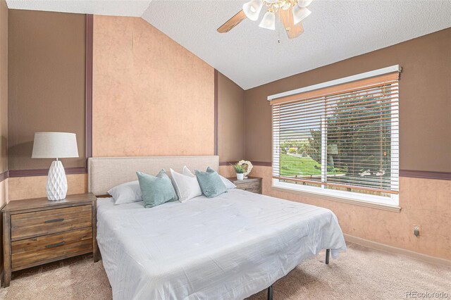 10152 Telluride St, Littleton, CO 80125 - bedroom featuring lofted ceiling, carpet flooring, a textured ceiling, and a ceiling fan