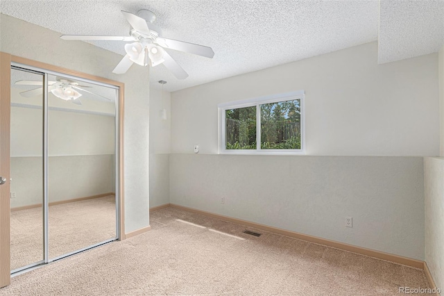 10152 Telluride St, Littleton, CO 80125 - unfurnished bedroom with carpet flooring, a textured ceiling, a closet, and ceiling fan