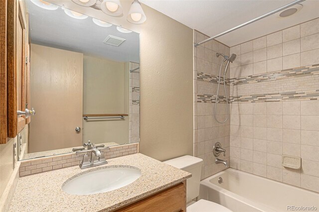 10152 Telluride St, Littleton, CO 80125 - bathroom featuring vanity, shower / bathtub combination, and a textured wall