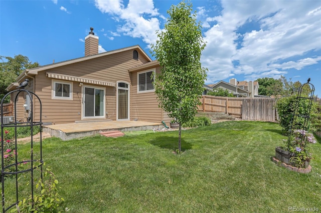 10152 Telluride St, Littleton, CO 80125 - rear view of property with a chimney and a patio