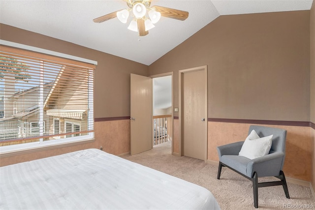 10152 Telluride St, Littleton, CO 80125 - bedroom with lofted ceiling, carpet flooring, a wainscoted wall, and a ceiling fan