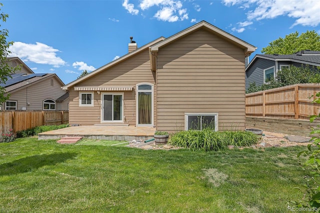 10152 Telluride St, Littleton, CO 80125 - back of house with a patio, a chimney, and a fenced backyard