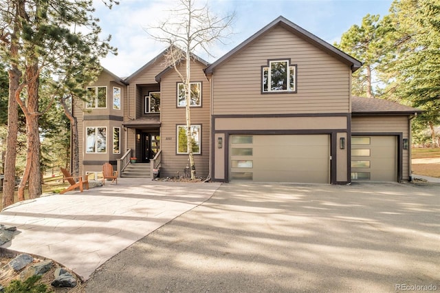 2253 Augusta Dr, Evergreen, CO 80439 - view of front of property with driveway and an attached garage