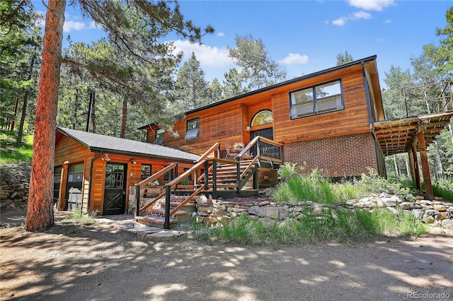 11701 Spruce Canyon Cir, Golden, CO 80403 - chalet / cabin featuring an outbuilding and stairs