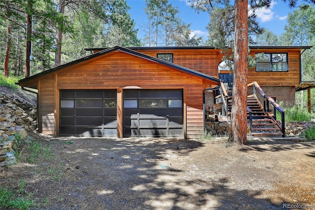 11701 Spruce Canyon Cir, Golden, CO 80403 - view of front of property with stairs and a garage