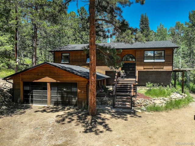 11701 Spruce Canyon Cir, Golden, CO 80403 - view of front of house featuring a detached garage and stairway