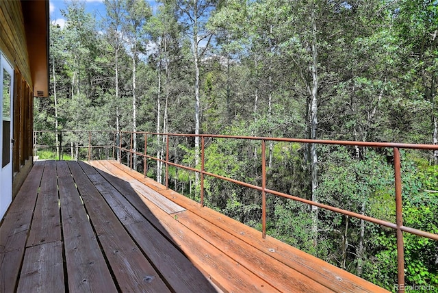 11701 Spruce Canyon Cir, Golden, CO 80403 - wooden terrace with a view of trees