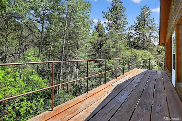 11701 Spruce Canyon Cir, Golden, CO 80403 - wooden terrace with a view of trees