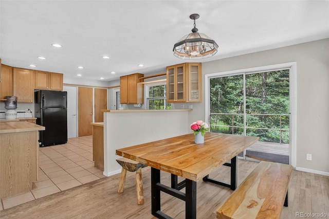 11701 Spruce Canyon Cir, Golden, CO 80403 - dining space featuring recessed lighting, plenty of natural light, light wood finished floors, and a chandelier