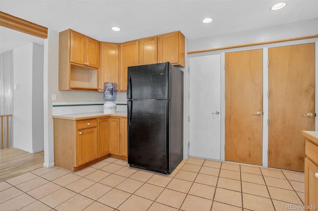 11701 Spruce Canyon Cir, Golden, CO 80403 - kitchen with freestanding refrigerator, light countertops, light tile patterned flooring, recessed lighting, and open shelves