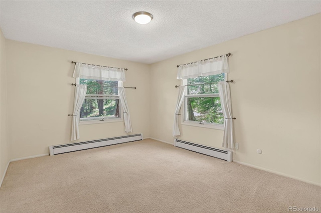 11701 Spruce Canyon Cir, Golden, CO 80403 - carpeted spare room featuring a baseboard heating unit and a textured ceiling