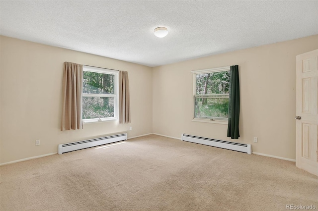 11701 Spruce Canyon Cir, Golden, CO 80403 - carpeted spare room featuring a baseboard heating unit and a textured ceiling