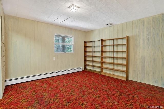 11701 Spruce Canyon Cir, Golden, CO 80403 - spare room with a baseboard heating unit, wood walls, and carpet floors
