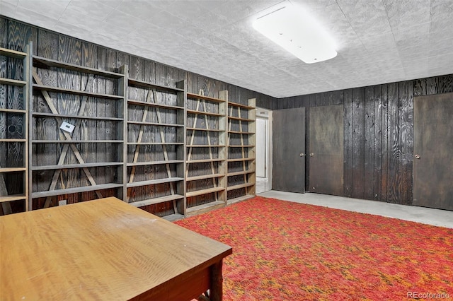 11701 Spruce Canyon Cir, Golden, CO 80403 - office area with wood walls and concrete floors