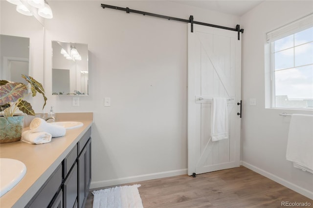 8582 Cheraw St, Littleton, CO 80125 - full bathroom with double vanity and wood finished floors