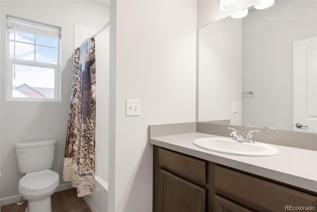 8582 Cheraw St, Littleton, CO 80125 - full bathroom with vanity, wood finished floors, and shower / tub combo with curtain