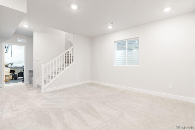 8582 Cheraw St, Littleton, CO 80125 - spare room featuring stairs, light carpet, recessed lighting, and healthy amount of natural light