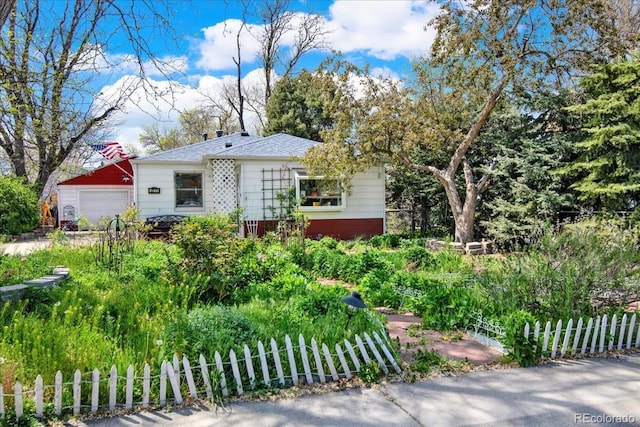 5211 Dover St, Arvada, CO 80002 - bungalow-style home featuring fence and a garage