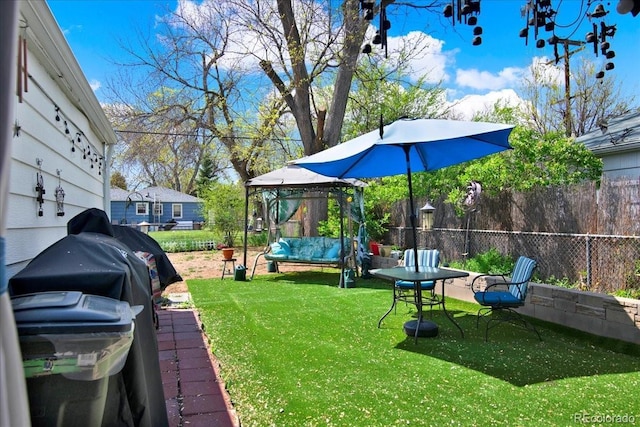 5211 Dover St, Arvada, CO 80002 - view of yard featuring a gazebo and outdoor lounge area