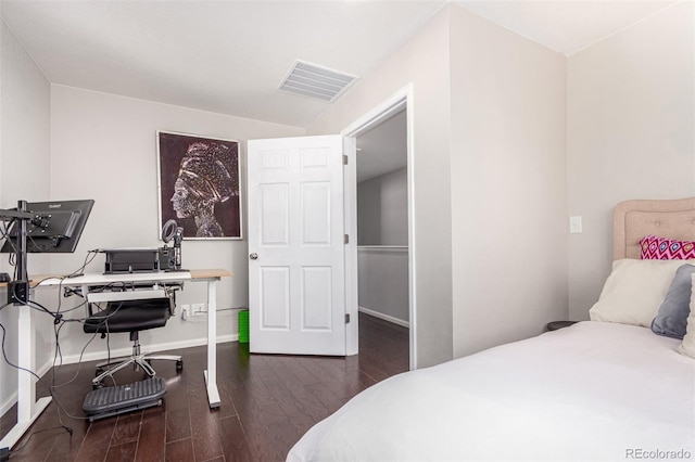 bedroom featuring dark hardwood / wood-style flooring